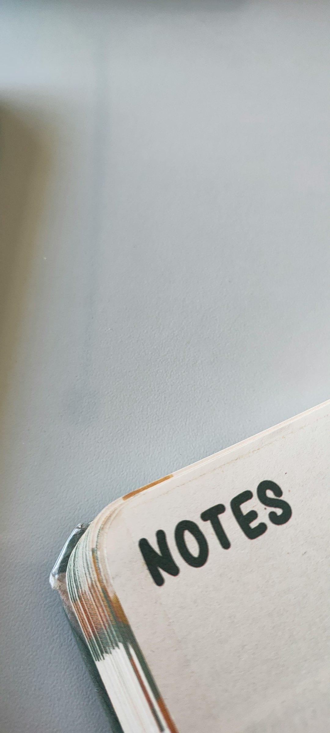 Handwritten psychological research notes and diagrams on a wooden desk with a fountain pen