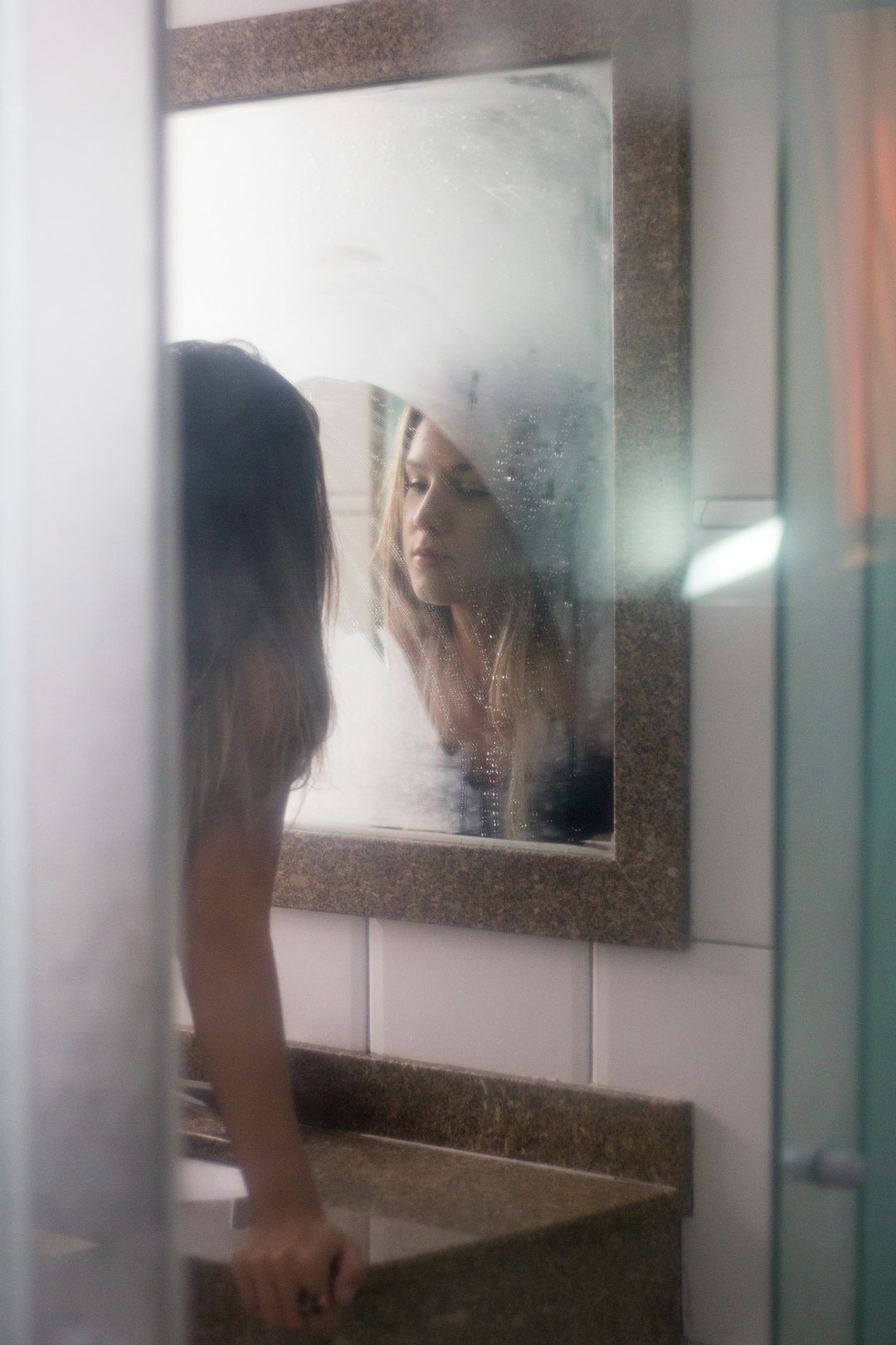 person looking in mirror
