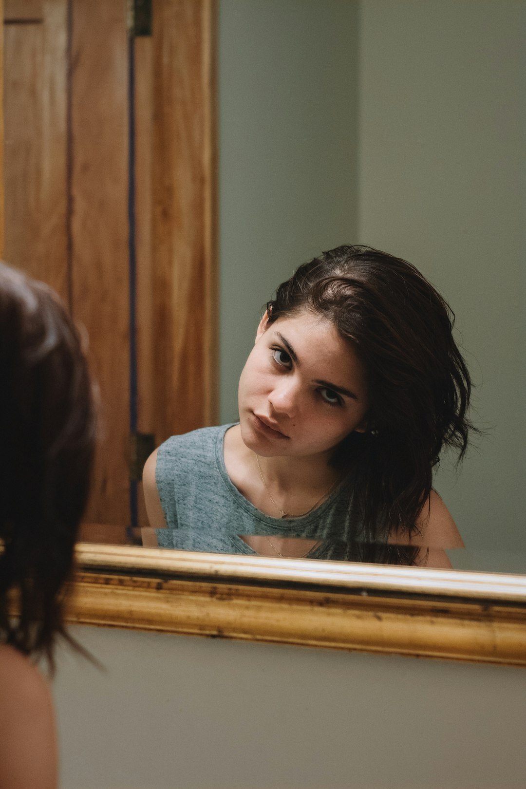 person looking in mirror